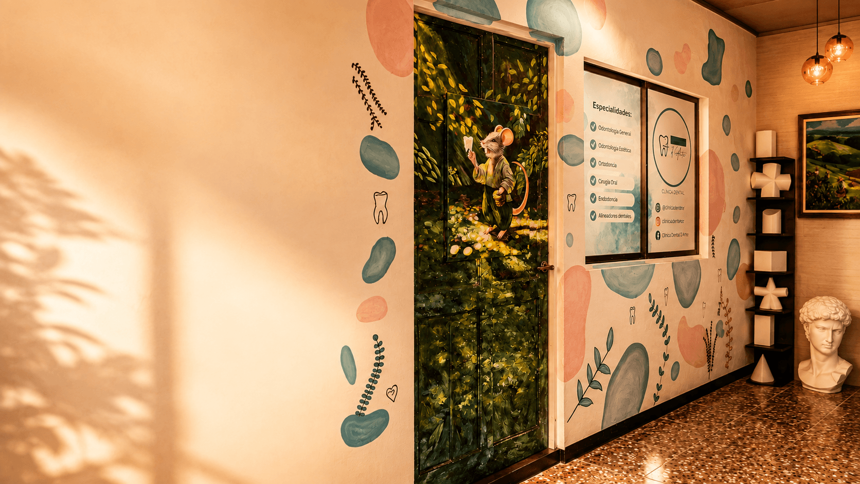Recepción de Clínica Dental D'Arte: puerta con mural artístico y esculturas